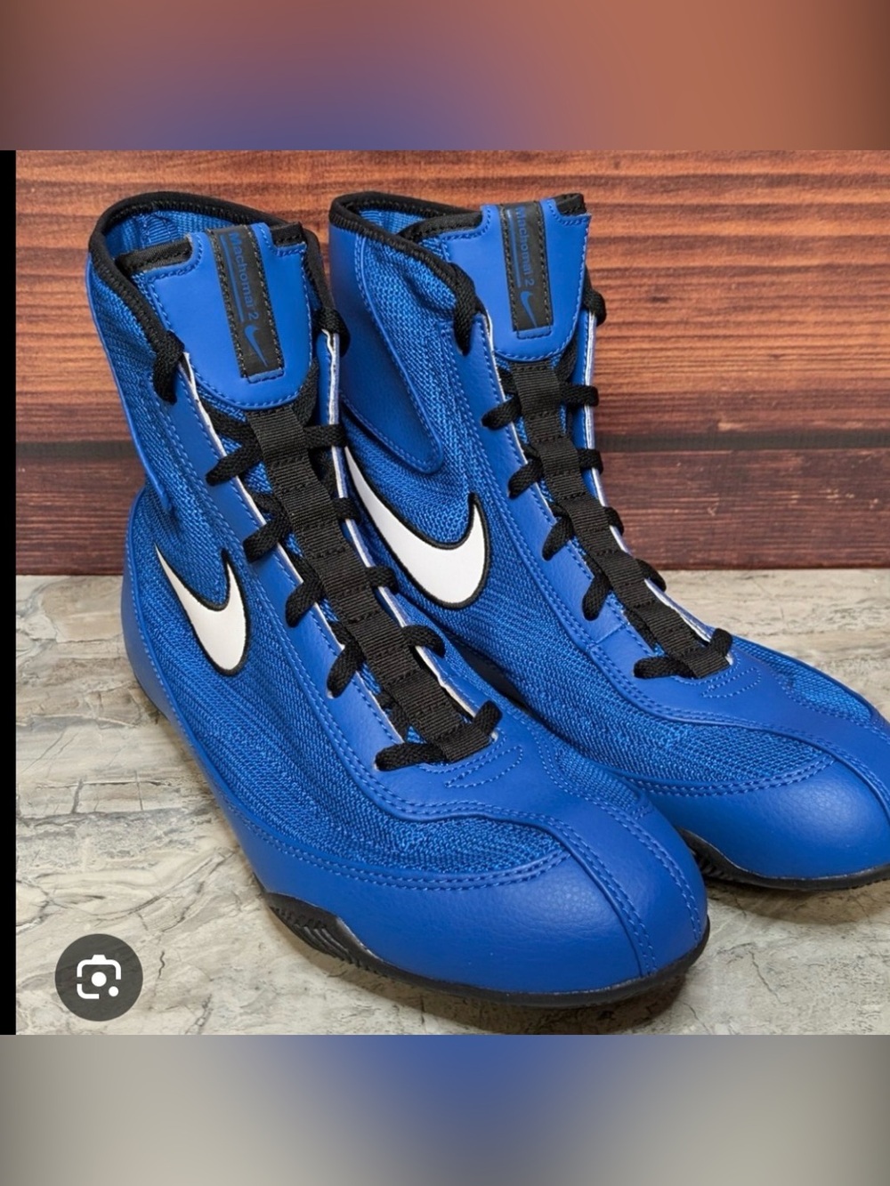 Nike Blue High-Top Sneakers with White Swoosh and Black Laces